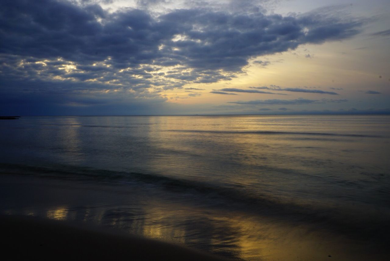 SCENIC VIEW OF SEA AT SUNSET