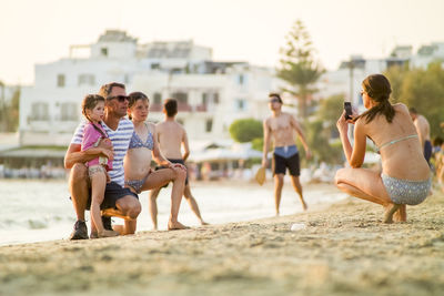 Friends standing on beach