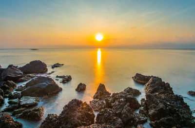 Scenic view of sea against sky during sunset