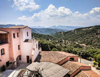 Buildings in town against sky