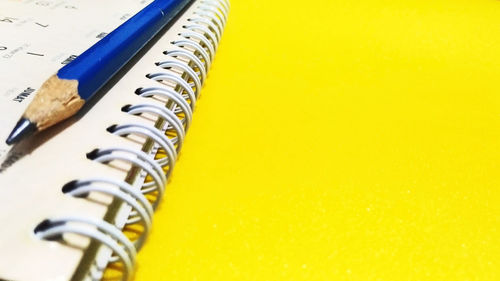 High angle view of yellow paper on table