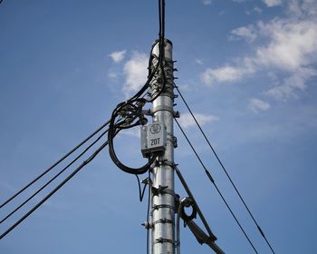 Low angle view of pole against sky