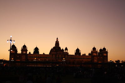 Silhouette of temple against clear sky