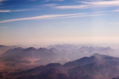 Scenic view of mountains against dramatic sky