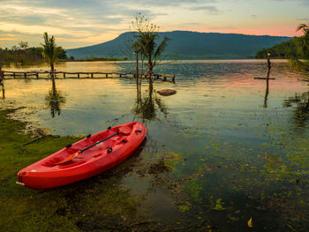 Scenic view of lake against sky during sunset