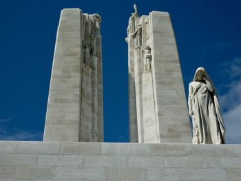 Low angle view of statue against sky