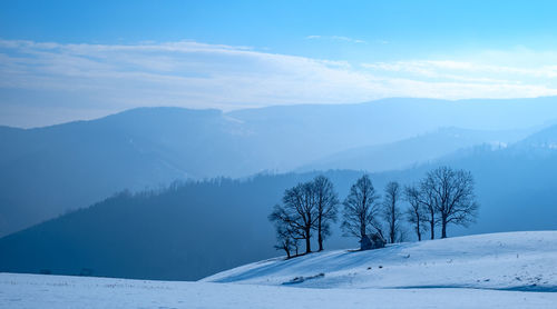 Sun over the winter mountains with snow, cindrel mountains, paltinis, romania