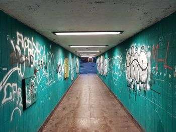 Graffiti on wall in illuminated building