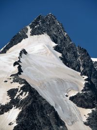 Scenic view of snow covered mountains