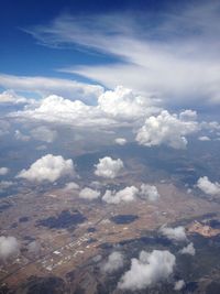 Aerial view of landscape against cloudy sky