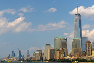 Modern buildings in city against sky