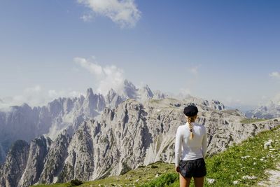 Woman hiking in the dolomite mountains