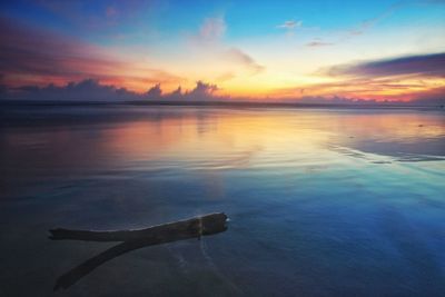 Scenic view of sea against sky at sunset