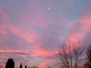 Low angle view of cloudy sky at sunset