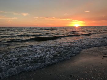 Scenic view of beach against sky during sunset