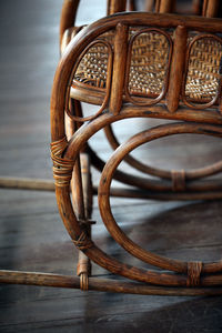 Close-up of old bamboo chair on floor