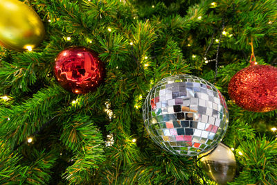 Close-up of christmas decorations hanging on tree