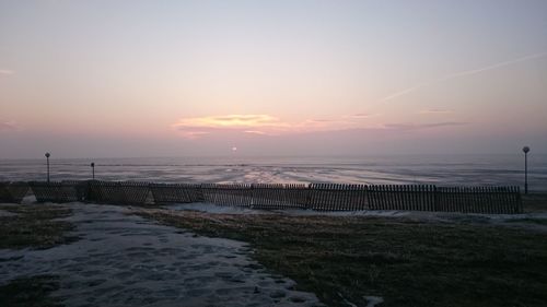 Scenic view of sea against sky at sunset