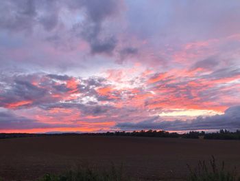 Scenic view of dramatic sky during sunset