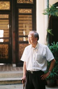 Full length of man standing outside building