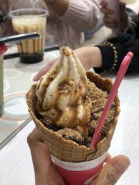 Midsection of person holding ice cream