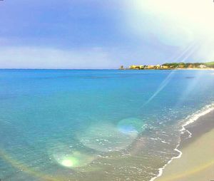 Scenic view of sea against blue sky