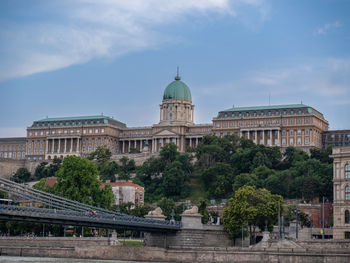 Buildings in city against sky