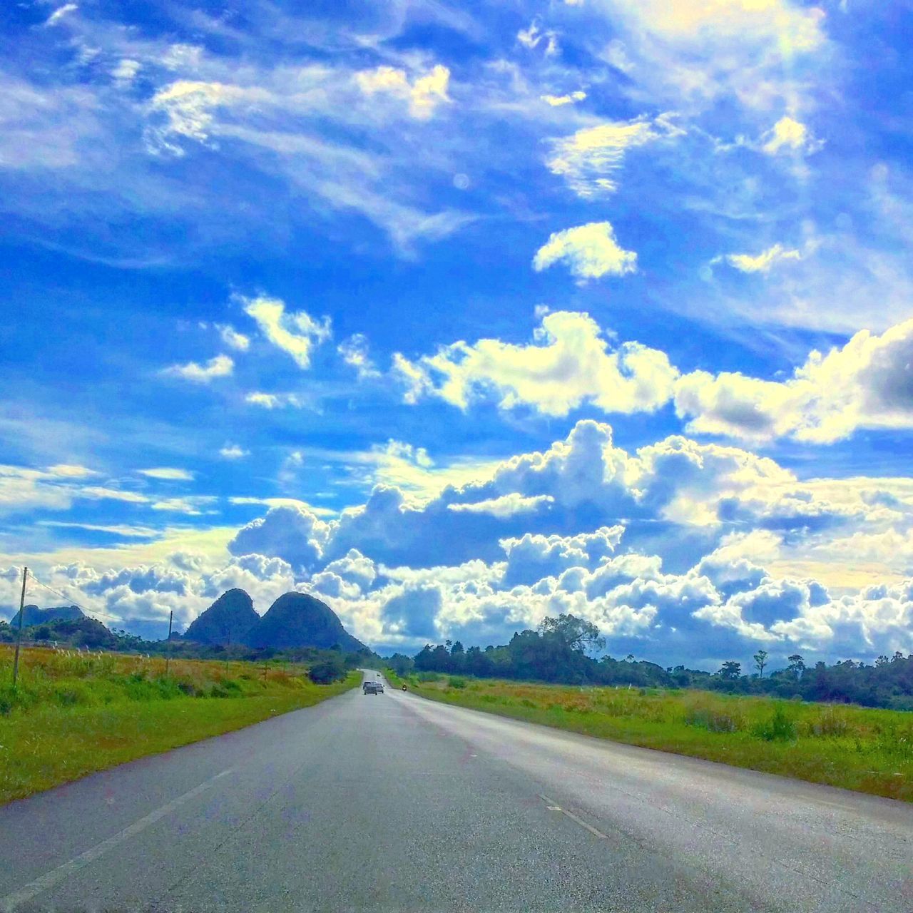 ROAD AGAINST BLUE SKY