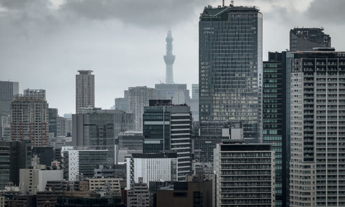 Modern buildings in city against sky