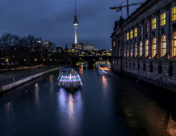 Boats on canal at night