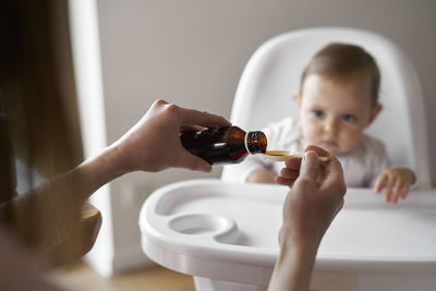 Close-up of boy washing hands