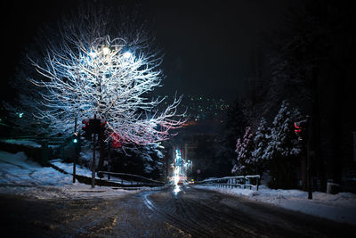 Firework display in city at night during winter