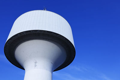 Low angle view of tower against clear blue sky