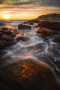 Scenic view of sea against sky during sunset