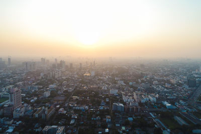 High angle view of buildings against sky during sunset