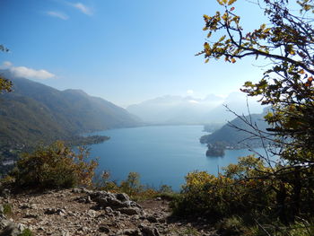 Scenic view of mountains and sea against sky