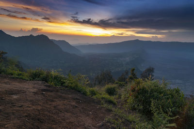 Scenic view of mountains against sky during sunset