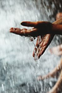 Close-up of hand splashing water