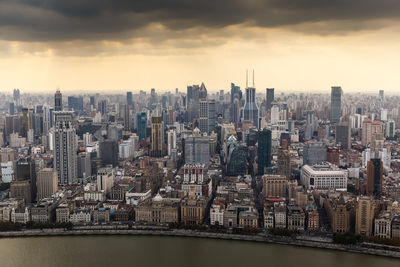 Aerial view of modern buildings in city against sky