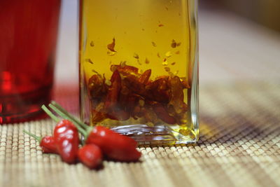 Close-up of tomatoes in jar on table