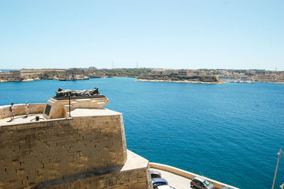 Scenic view of sea against clear blue sky