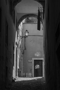 Woman walking in corridor of building