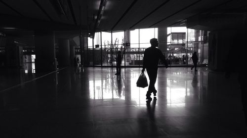 Silhouette of woman in corridor