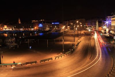 High angle view of light trails on city street at night