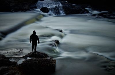 Full length of man standing on rock