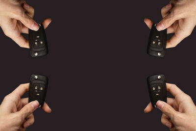 Cropped hand using remote control at home