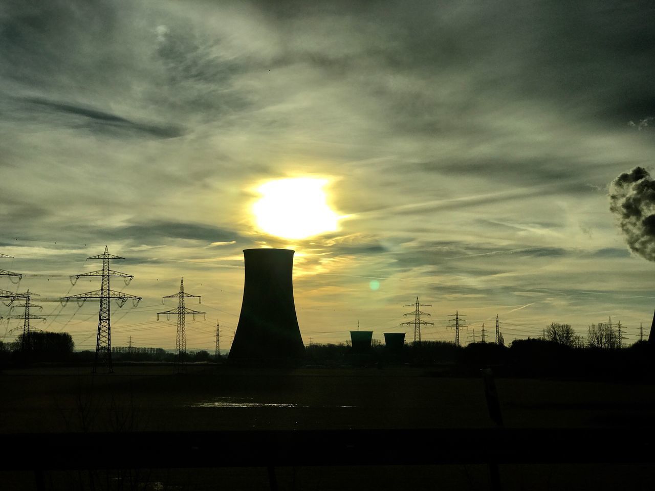 LOW ANGLE VIEW OF SILHOUETTE ELECTRICITY PYLON AGAINST SKY DURING SUNSET