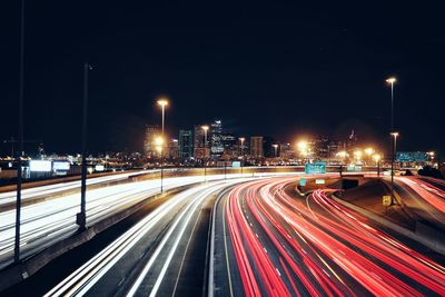 High angle view of light trails on multiple lane highway at night