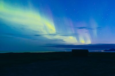 Scenic view of sea against sky at night