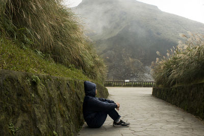 Man sitting on mountain